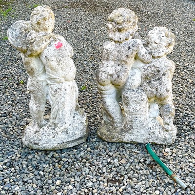 Lot 605 - A reconstituted stone fountain, modelled as putti playing pan pipes.