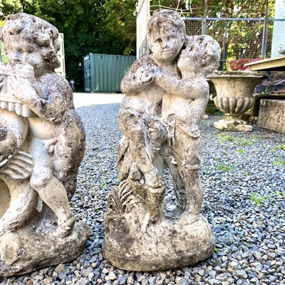 Lot 605 - A reconstituted stone fountain, modelled as putti playing pan pipes.