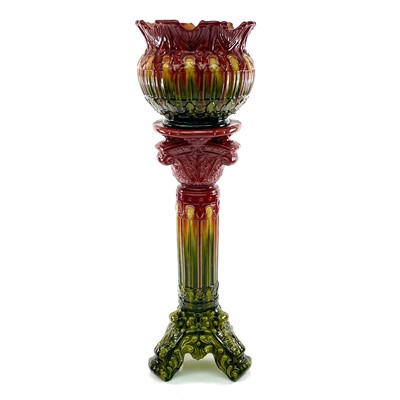 Lot 944 - A late Victorian majolica jardiniere and stand,...