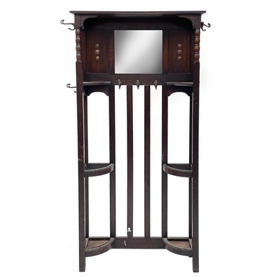 Lot 1913 - An oak hallstand, with central mirror and...