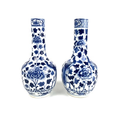 Lot 237 - A pair of Chinese blue and white porcelain bottle vases, late 19th century.