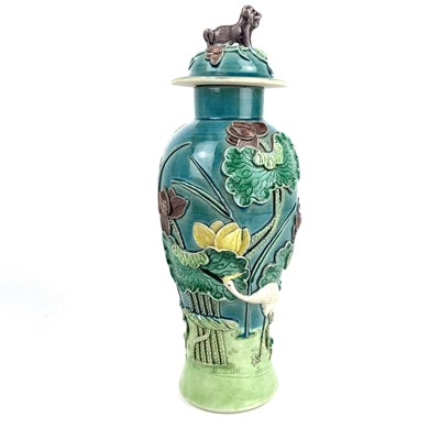 Lot 239 - A Chinese sancai glazed porcelain baluster vase and cover, late 19th century.