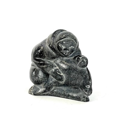 Lot 132 - A 20th century Inuit carved soapstone sculpture.