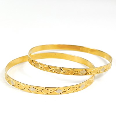 Lot 80 - An Indian 22ct gold pair of bangles.