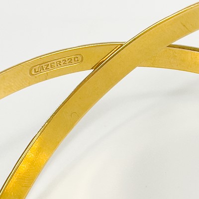 Lot 80 - An Indian 22ct gold pair of bangles.