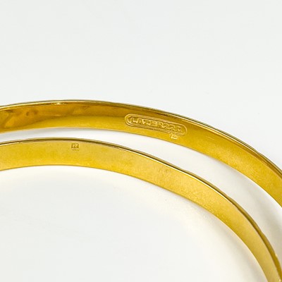 Lot 80 - An Indian 22ct gold pair of bangles.