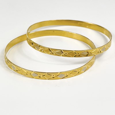 Lot 80 - An Indian 22ct gold pair of bangles.