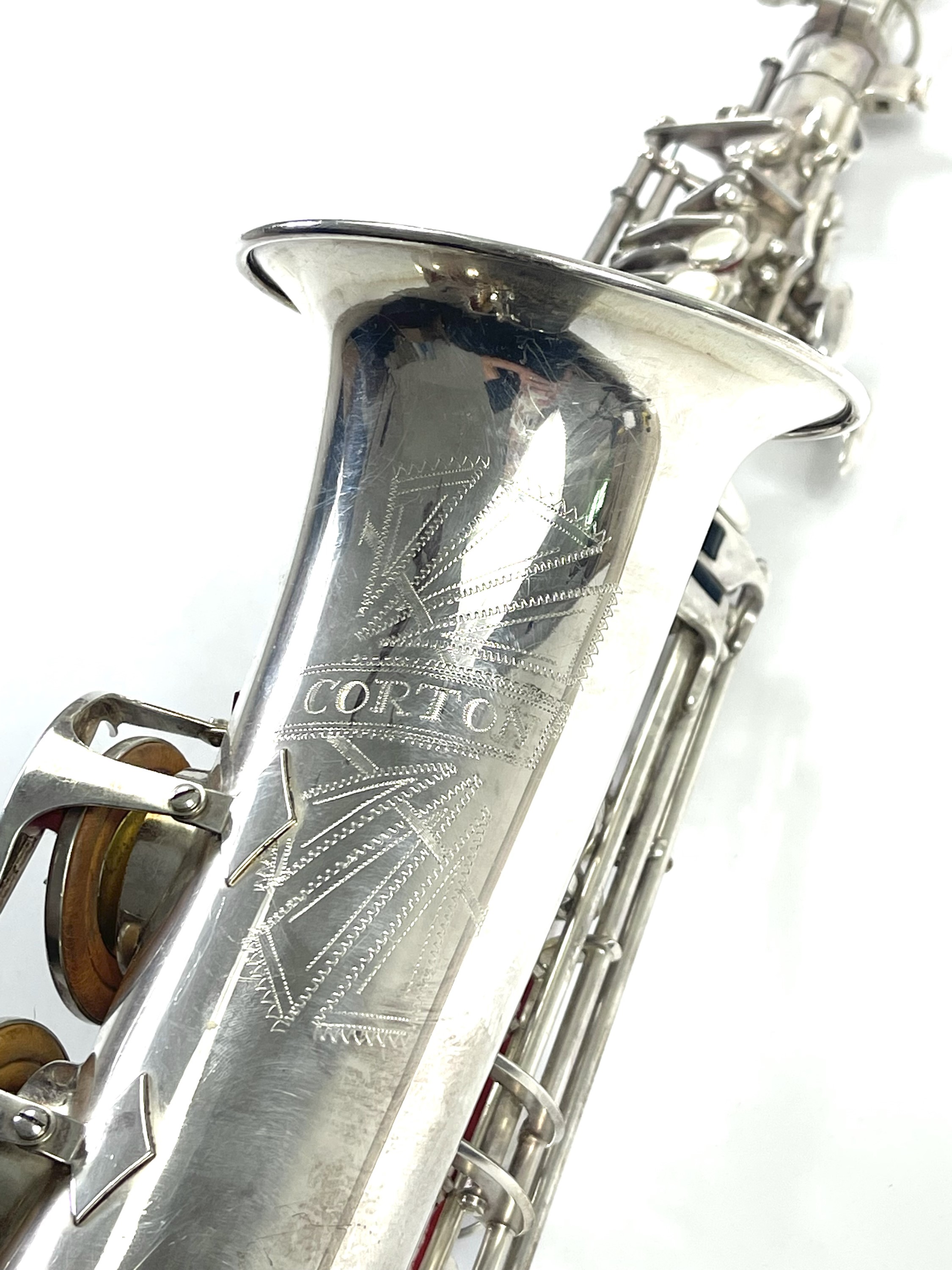 Lot 239 A midcentury Corton Alto Saxophone.