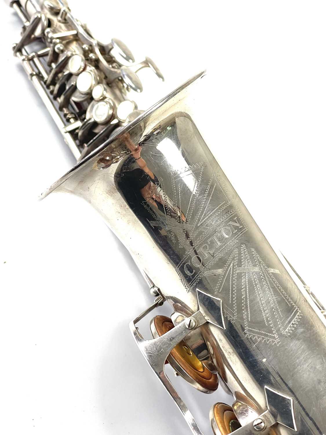 Lot 239 A midcentury Corton Alto Saxophone.