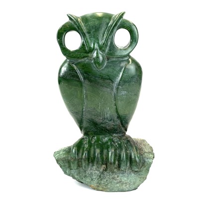 Lot 313 - An African green stone carving of an owl, Signed G Carimari.