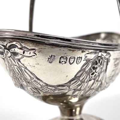 Lot 86 - A Victorian silver swing handled pedestal sugar basket by Charles Stuart Harris.