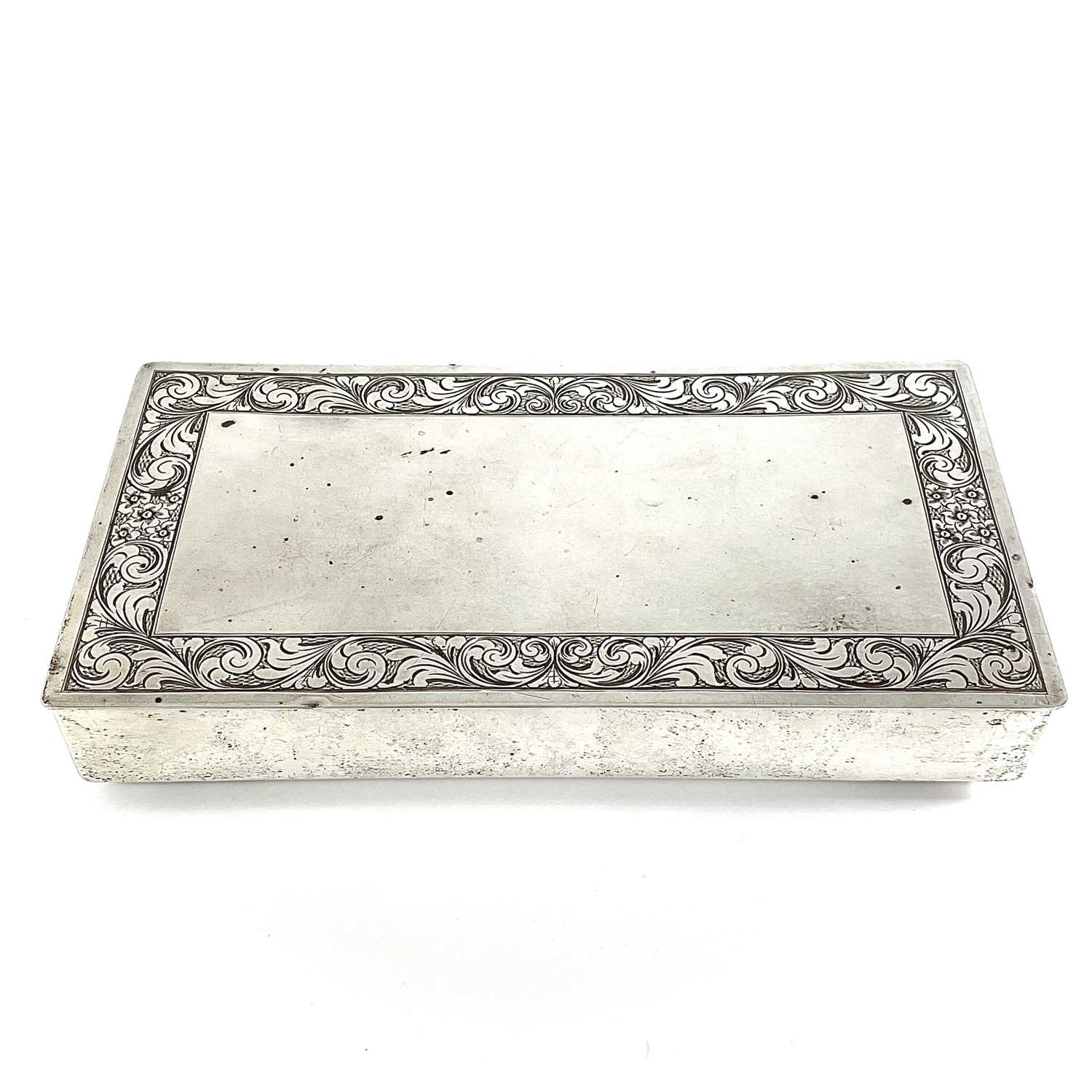 Lot 235 - A white metal rectangular cigarette box.