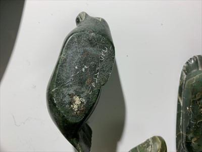 Lot 165 - Three Inuit soapstone carvings of seals,...