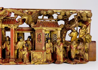 Lot 18 - A Chinese carved red painted and giltwood panel.