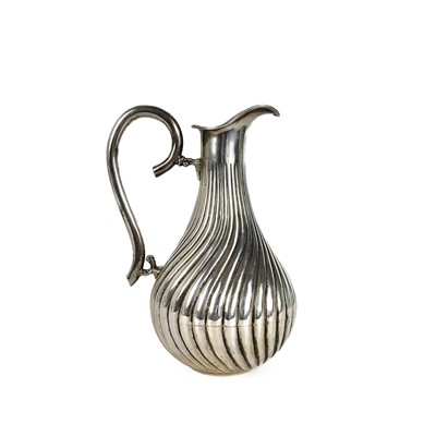 Lot 143 - A 20th century Columbian 0.900 silver wrythen fluted jug.