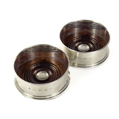 Lot 66 - A pair of modern silver wine coasters.