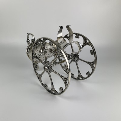 Lot 397 - A WMF silver plated wine bottle carriage.