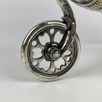 Lot 397 - A WMF silver plated wine bottle carriage.