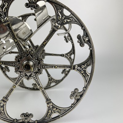 Lot 397 - A WMF silver plated wine bottle carriage.