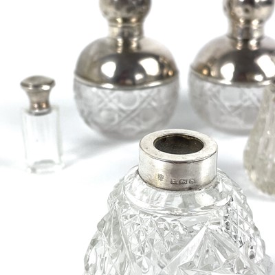 Lot 73 - A pair of George V silver mounted cut glass ovoid scent bottles.
