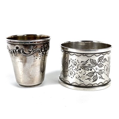 Lot 125 - A French silver small cup and an Edwardian silver napkin ring.