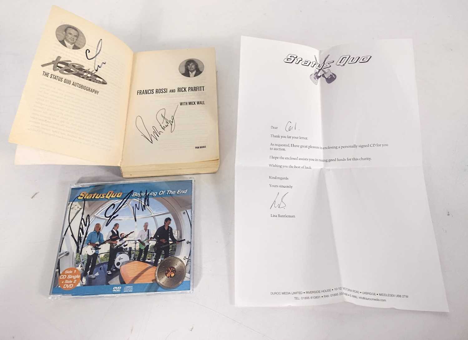 Lot 331 - Signed Status Quo CD and book.