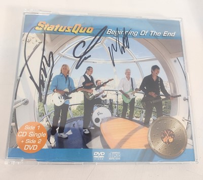 Lot 331 - Signed Status Quo CD and book.