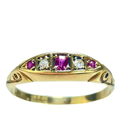 Lot 169 - An Edwardian 18ct gold diamond and garnet five stone ring.