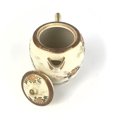 Lot 199 - A Japanese Satsuma teapot, 19th century, signed.