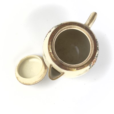 Lot 199 - A Japanese Satsuma teapot, 19th century, signed.
