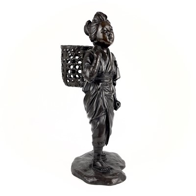 Lot 66 - A Japanese bronze figure of a girl carrying a basket. Meiji period.