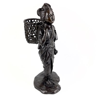 Lot 66 - A Japanese bronze figure of a girl carrying a basket. Meiji period.