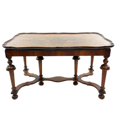 Lot 1924 - A walnut coffee table.