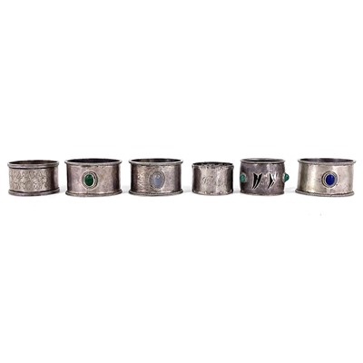 Lot 128 - A set of three Jack Kirsten Baily Guild of Handicrafts silver cabochon stone set napkin rings.