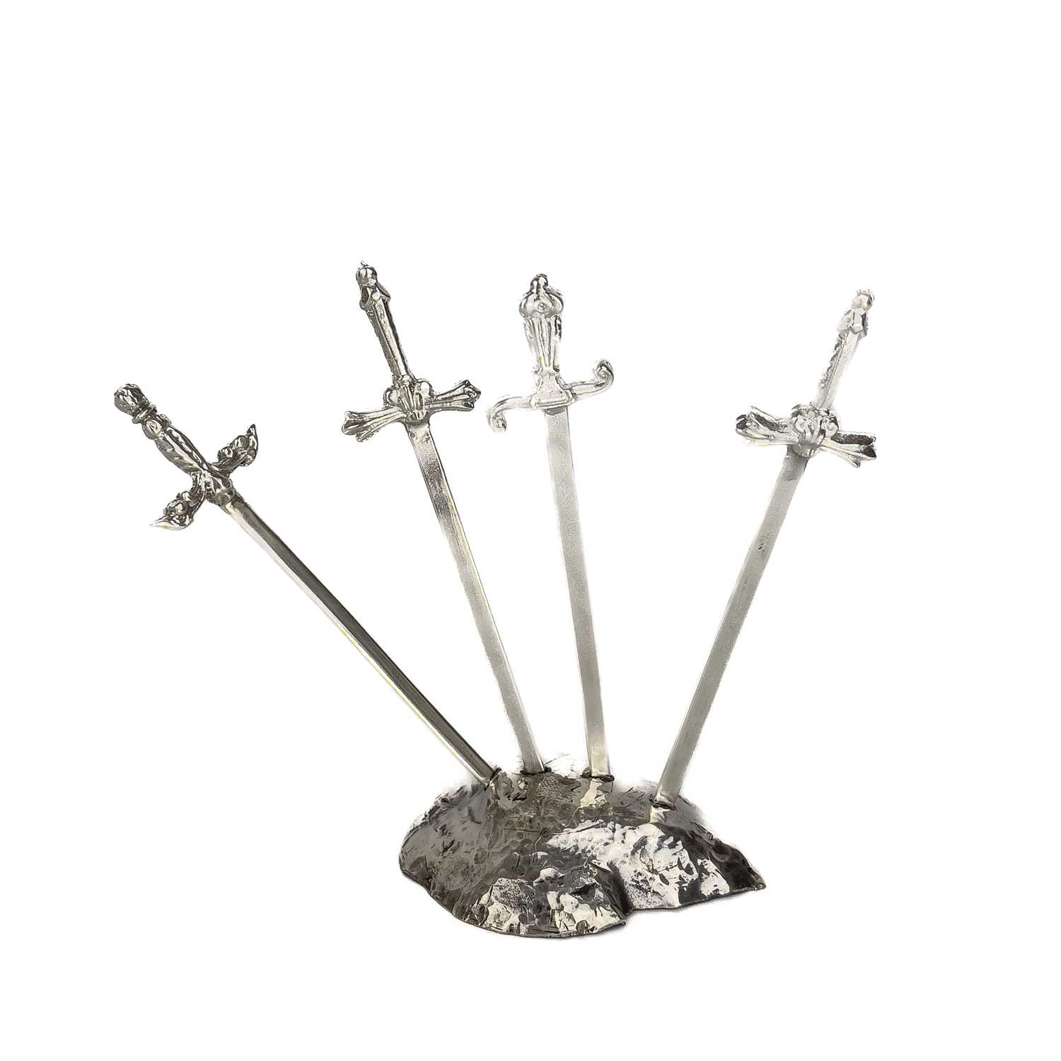 Lot 327 - Contemporary .999 fine silver 'Sword in the stone' picks by James Suddaby.