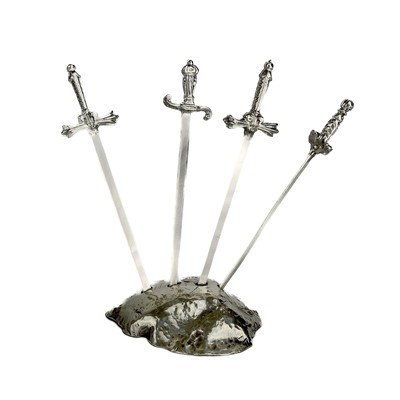 Lot 327 - Contemporary .999 fine silver 'Sword in the stone' picks by James Suddaby.
