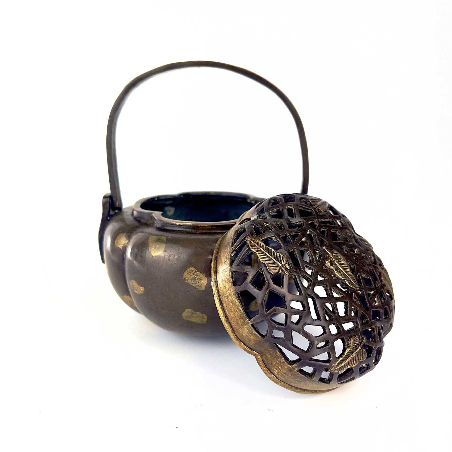 Lot 69 - A Chinese bronze hand warmer / portable incense burner, 19th century or earlier.