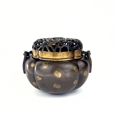 Lot 69 - A Chinese bronze hand warmer / portable incense burner, 19th century or earlier.