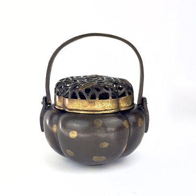 Lot 69 - A Chinese bronze hand warmer / portable incense burner, 19th century or earlier.