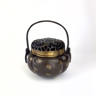 Lot 69 - A Chinese bronze hand warmer / portable incense burner, 19th century or earlier.
