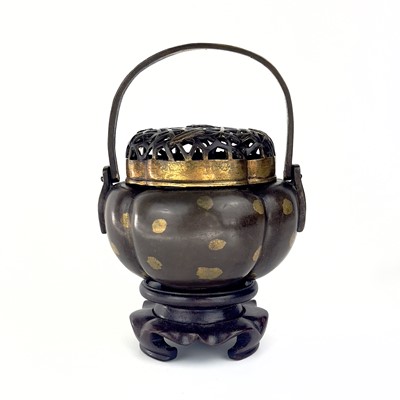 Lot 69 - A Chinese bronze hand warmer / portable incense burner, 19th century or earlier.