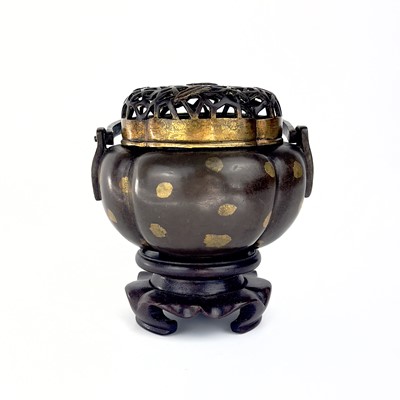 Lot 69 - A Chinese bronze hand warmer / portable incense burner, 19th century or earlier.