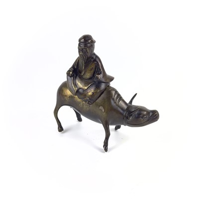 Lot 115 - A Chinese bronze incense burner modelled as a sage sitting on a buffalo, 19th century.