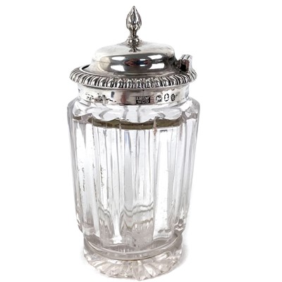 Lot 31 - A George IV silver mounted hinge lidded glass mustard pot.