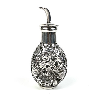 Lot 203 - A Chinese silver cased glass perfume bottle, with prunus blossom decoration.