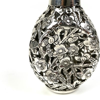 Lot 203 - A Chinese silver cased glass perfume bottle, with prunus blossom decoration.