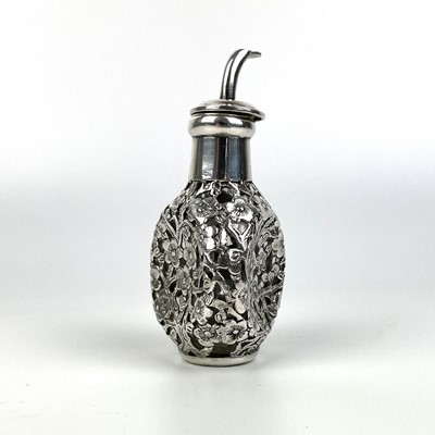 Lot 203 - A Chinese silver cased glass perfume bottle, with prunus blossom decoration.