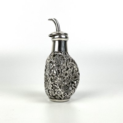 Lot 203 - A Chinese silver cased glass perfume bottle, with prunus blossom decoration.