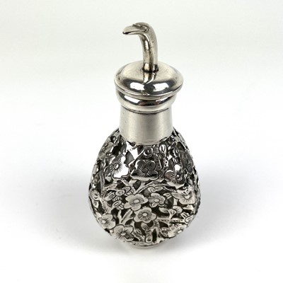 Lot 203 - A Chinese silver cased glass perfume bottle, with prunus blossom decoration.