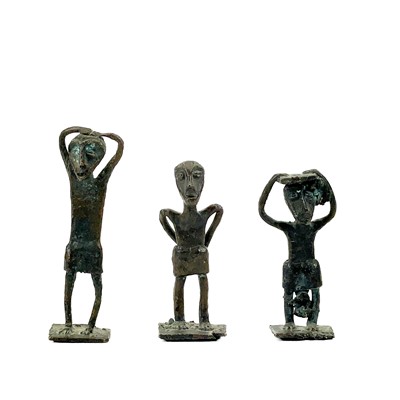 Lot 197 - A small Benin bronze figure modelled with his wrists bound behind his back.